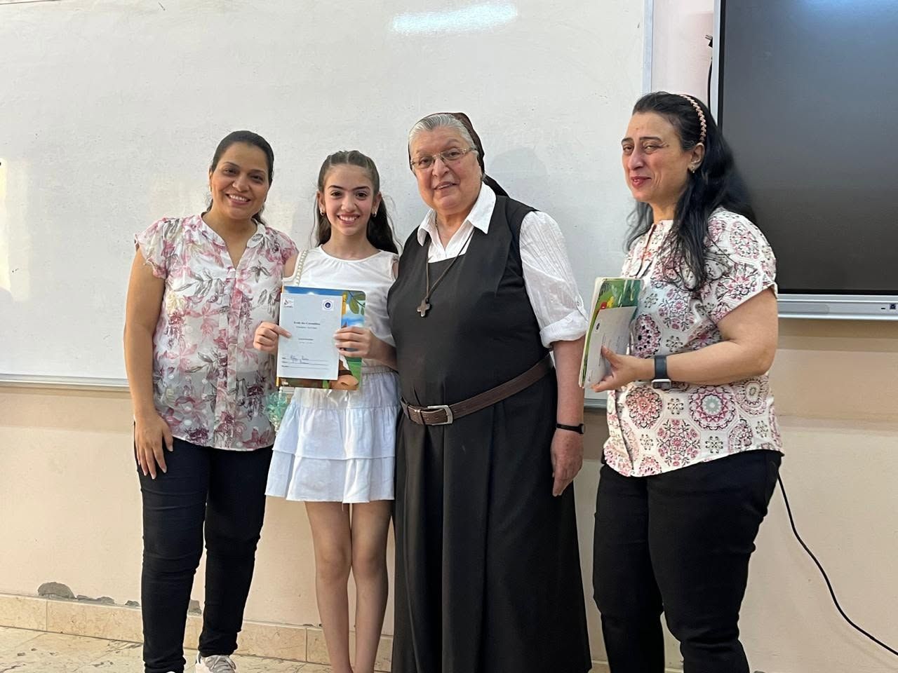 Award ceremony with students and teachers in the classroom