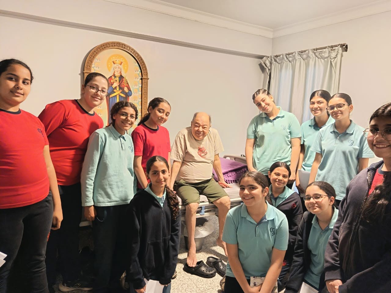 Students visiting an elderly community member during a service outing